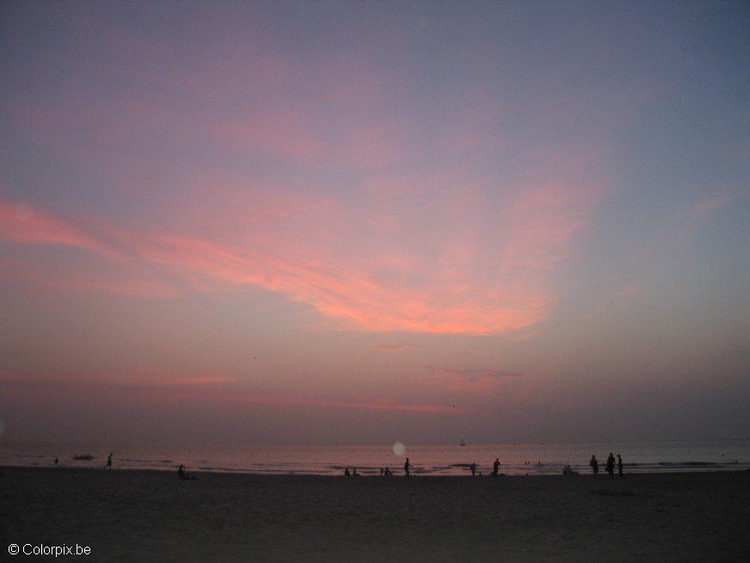 Foto tramonto in spiaggia