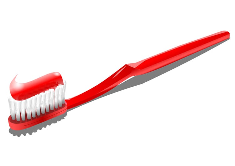 immagine spazzolino da denti e dentifricio